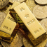 coins-gold-bars-scattered-table.jpg - Primorye24.Ru